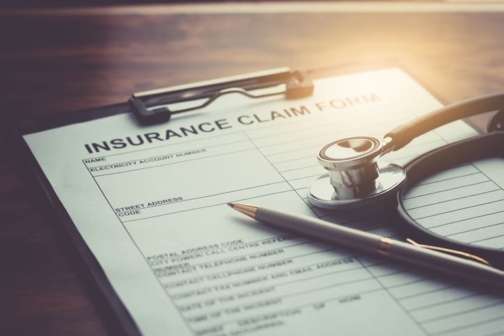 insurance claim form with stethoscope